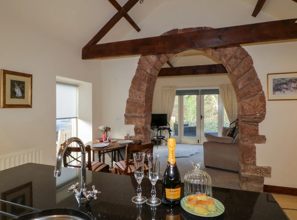 The interior has beautiful natural wooden beams and stone archways...