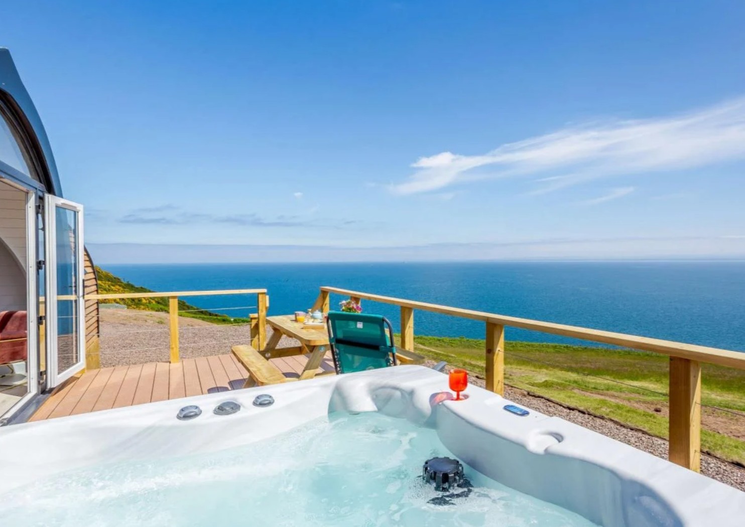 The hot tub has stunning ocean views...